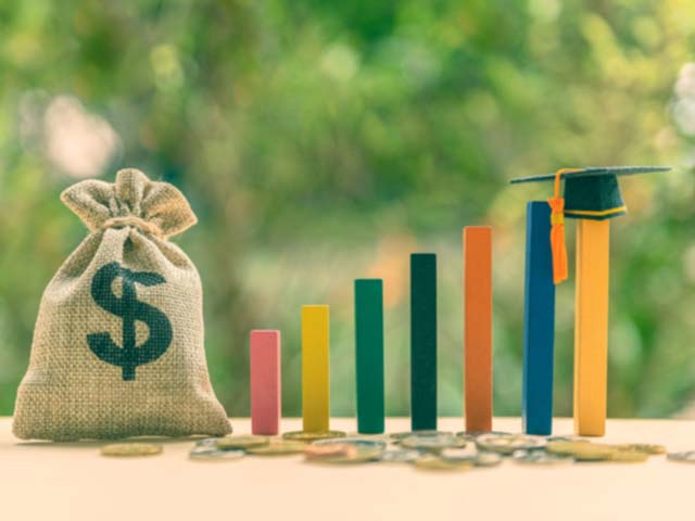 Bag of money with blocks representing a graph for school tuition