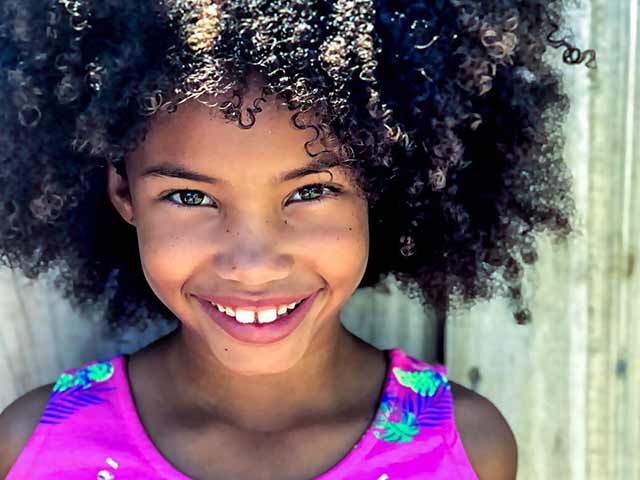 Young girl smiling at the camera